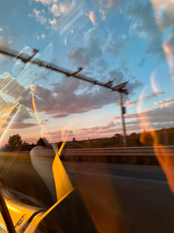 Sunset reflection captured in car window in Selyanin, Bulgaria