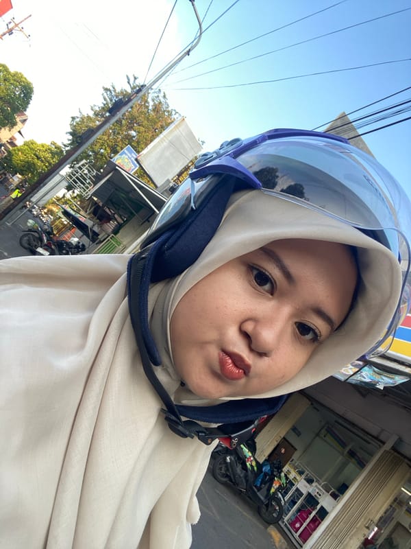 Woman takes motorcycle selfies near seafood restaurant in Sidoarjo