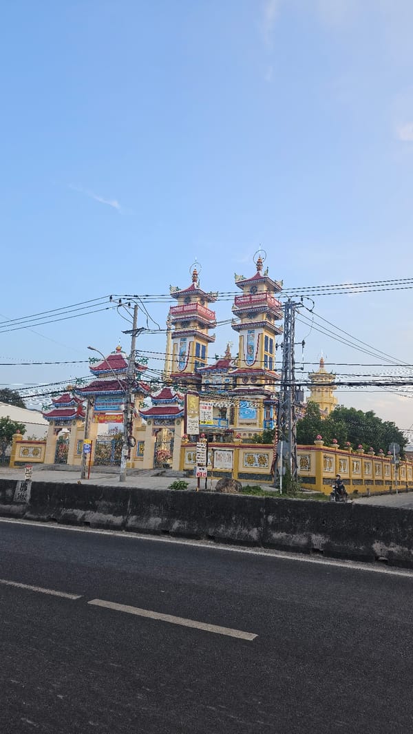 Colorful pagodas documented alongside roadway in Cam Đức, Vietnam