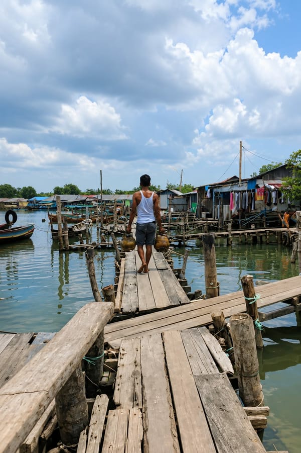 Quiet morning life along a wooden pier village near Medan