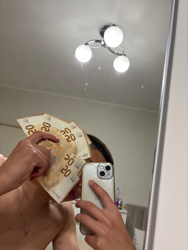 Young man takes mirror selfies with Euro cash in Sofia