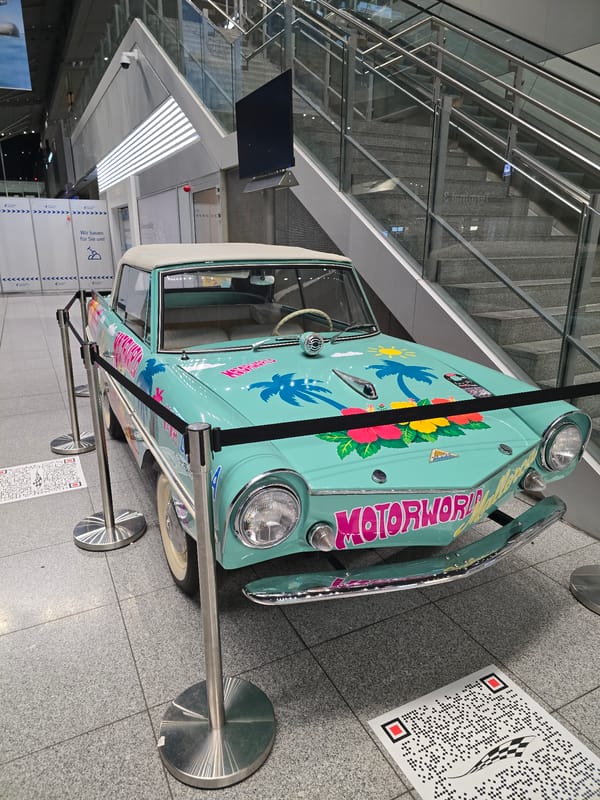 Tropical-themed vintage amphibious car on display in Stuttgart terminal