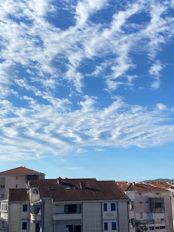 Morning rooftop views across Budva's mixed architecture