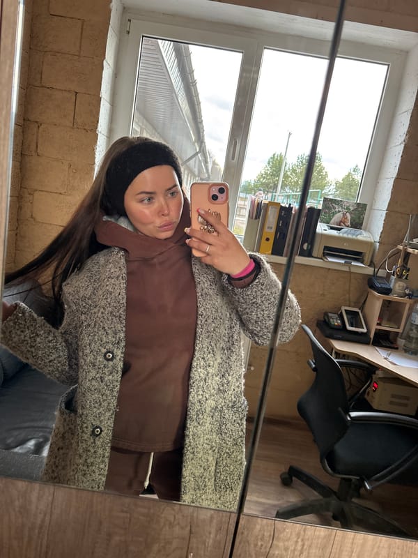 Domestic moments captured in Russian village: selfie and cat