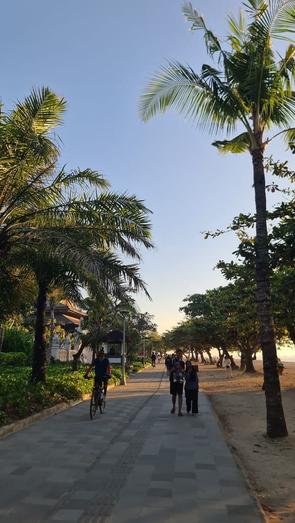 Sunset strolls and cycling along Denpasar's beachfront promenade