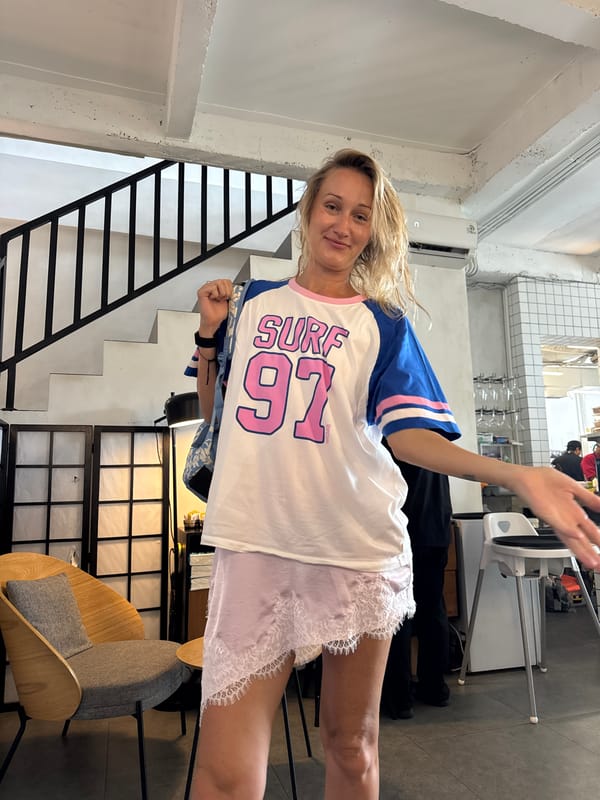 Woman greets at late-night cafe in Kuta Selatan