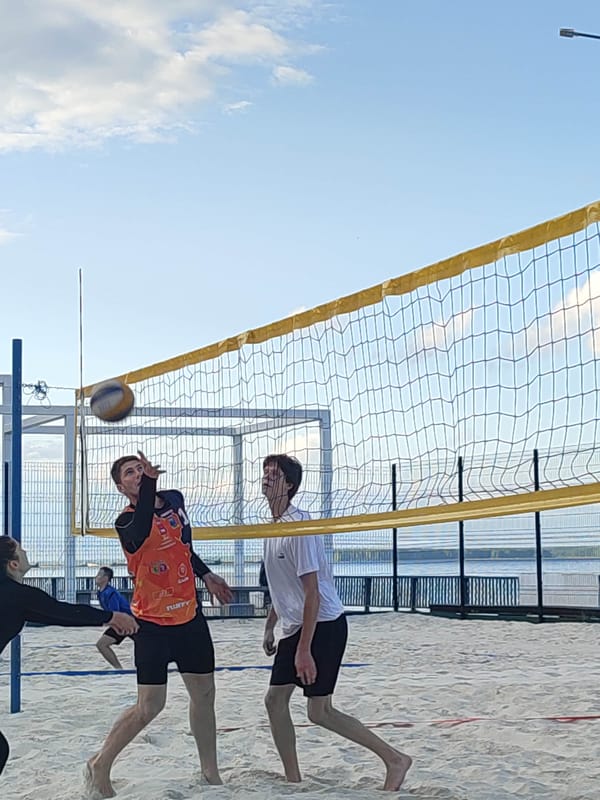 Afternoon beach volleyball session at a sandy outdoor court