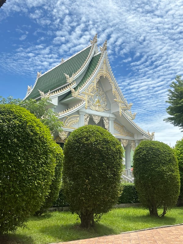 Temple visit with golden Buddhas and merit-making rituals