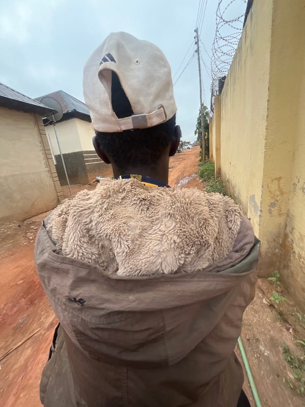 Person in brown jacket observed in Galadimawa alleyway