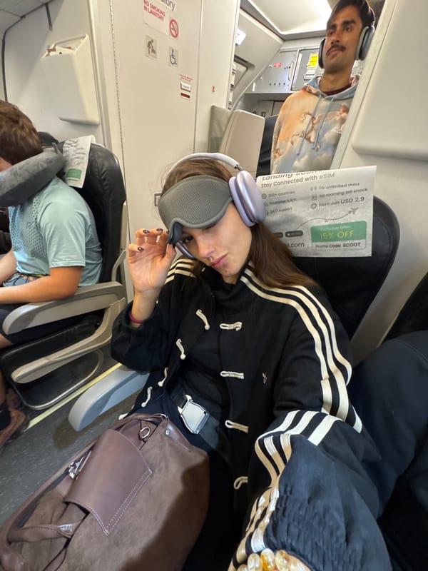 Passenger rests with eye mask during flight over Thailand