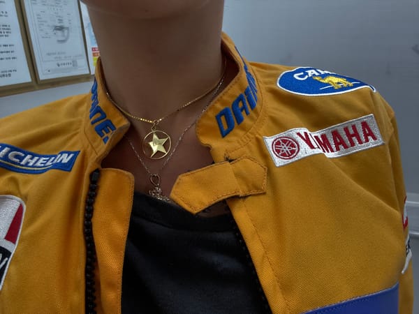Person in yellow racing jacket photographed in Seoul