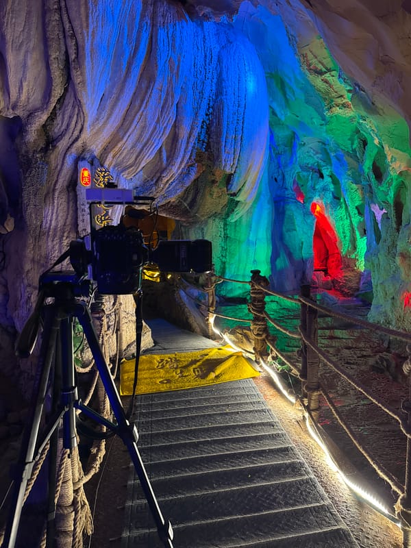 Tourist explores illuminated caves and scenic walkways in Zhuoshui