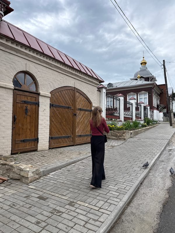 Pedestrians Navigate Izhevsk Streets on Overcast June Afternoon