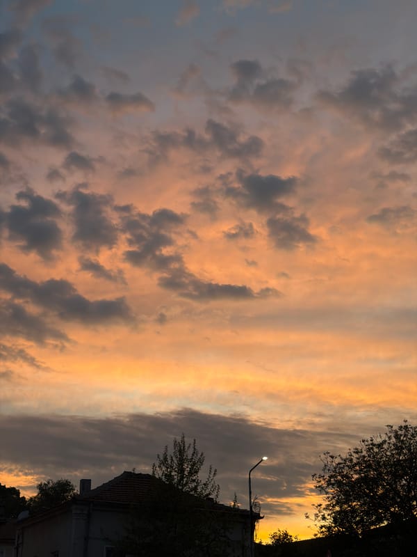 Sunset observed over Lovech, Bulgaria with orange-gray clouds