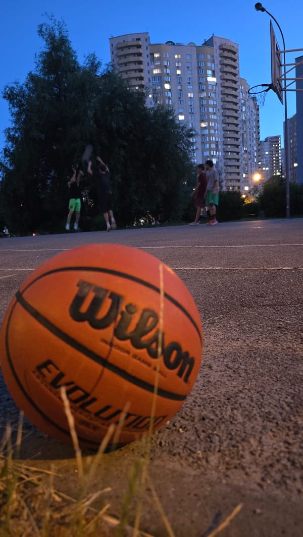 Summer evening sports and hangouts in a Kyiv residential neighborhood