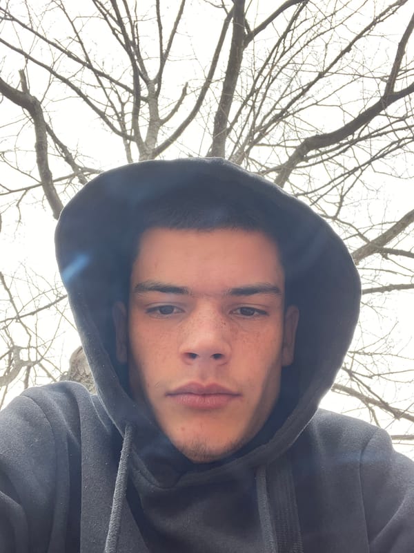 Young man takes selfies, smokes during grocery store visit