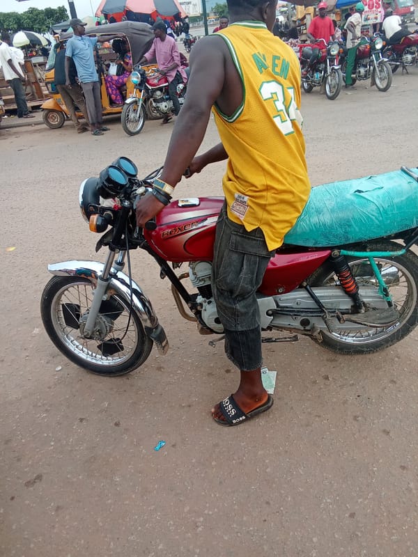 Motorcycle taxis and keke napeps fill the streets of Kubwa and Kagini