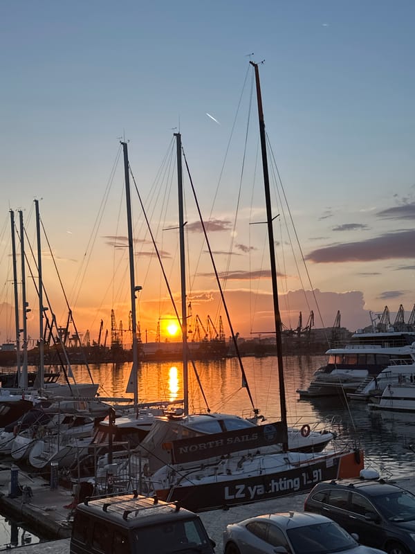 Sunset captured at Varna marina with boats and luxury cars