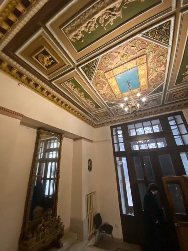 Moscow witness captures ornate building interior, rainy streets