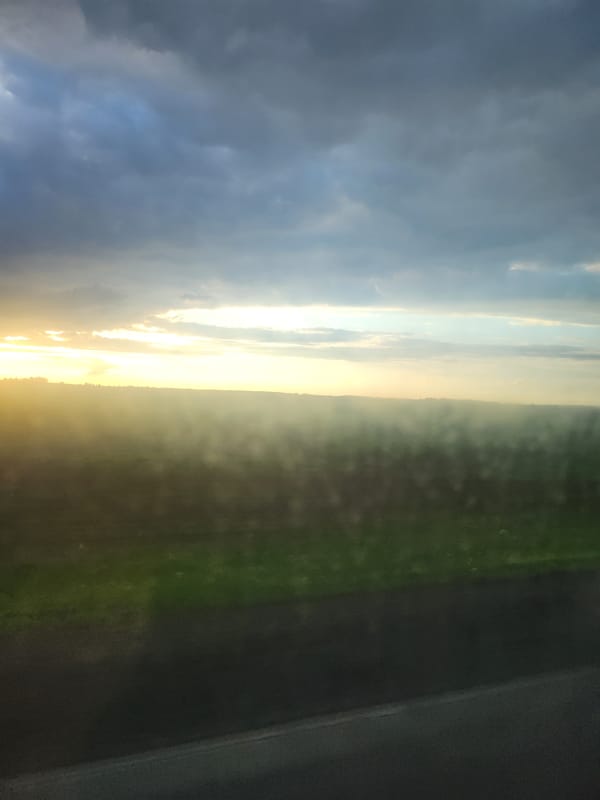 Sunrise or sunset landscape observed with golden light band