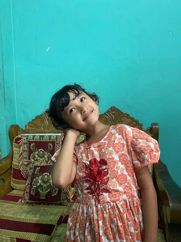 Children's playful morning moments captured in Dhaka homes