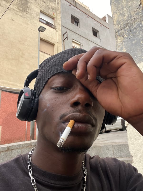 Man smoking, posing for photos in Barcelona streets