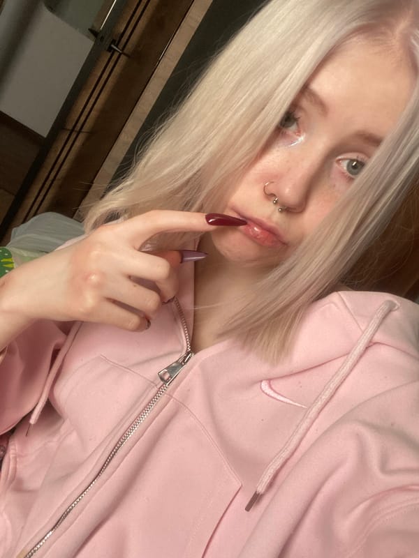 Young person photographs self in bedroom selfie session, Izhevsk