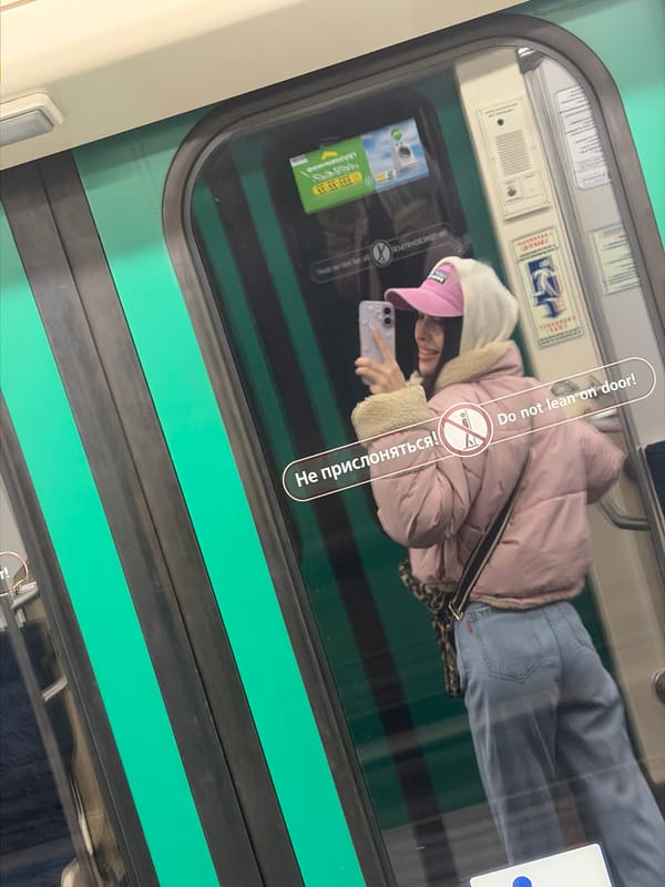 Woman Takes Selfies, Rests on Saint Petersburg Metro Train