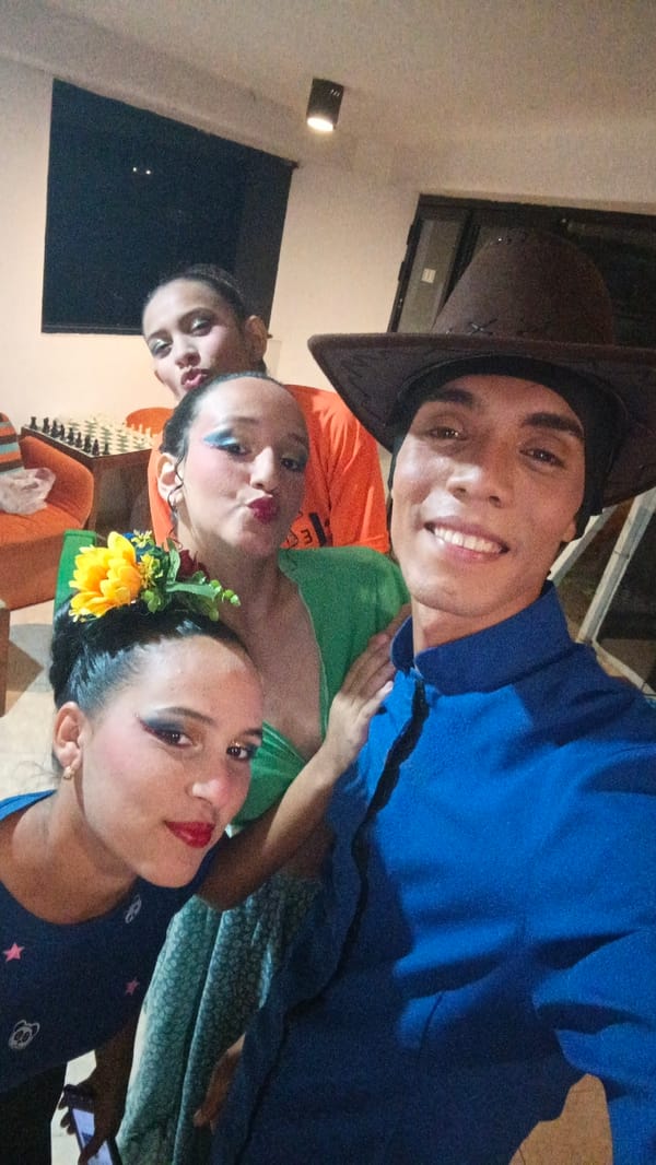 Young adults gather indoors at Playa El Agua, Venezuela