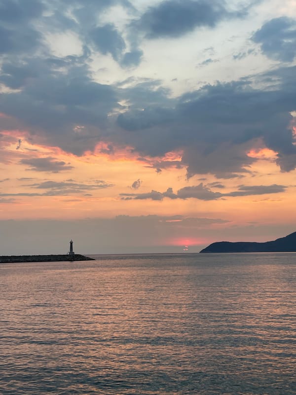 Golden hour at Bar's harbor lighthouse and Adriatic waterfront