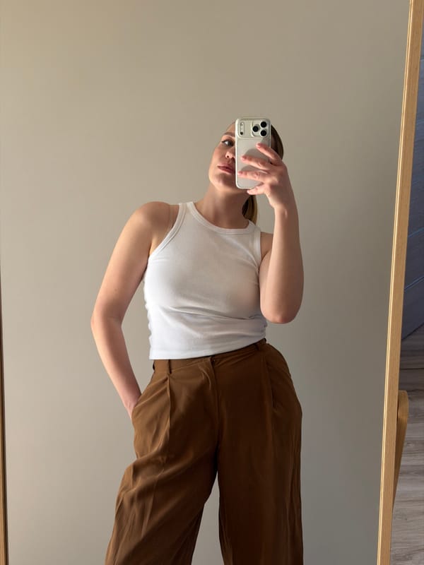Mirror selfie captured in rotated frame in Dreiliņi, Latvia