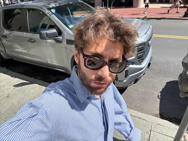 Man takes selfie with pickup truck in Boston