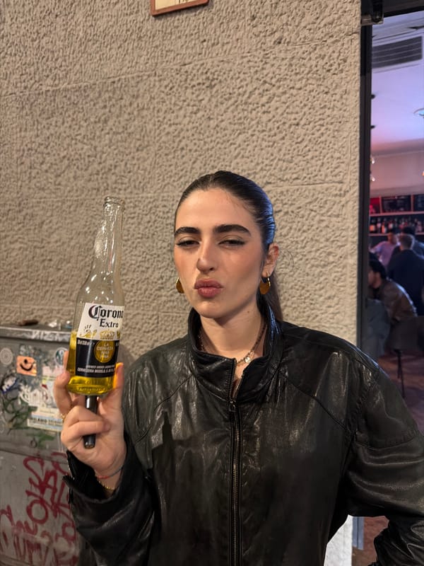 Woman spotted at Milan bar, later taking photos on sidewalk