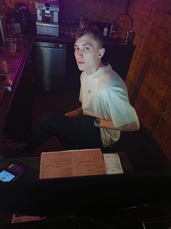 Man sits at neon-lit bar in Krasnoyarsk