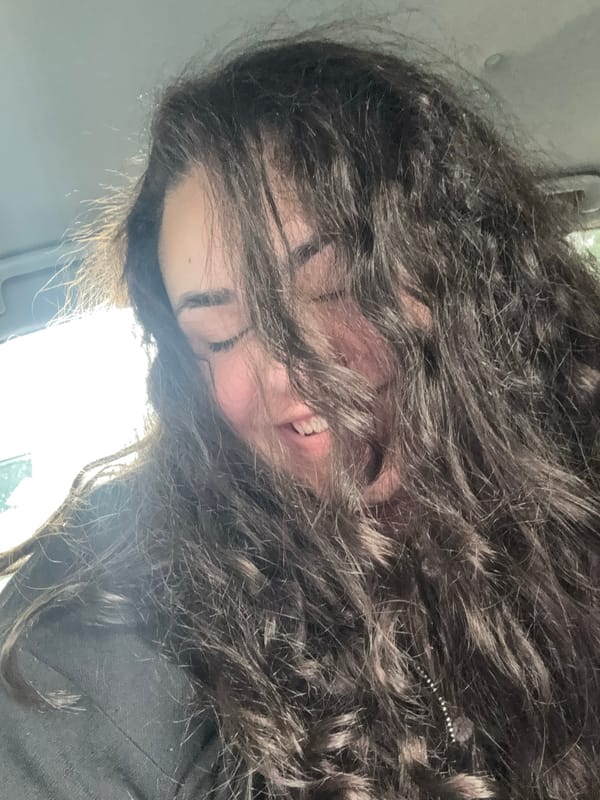 Woman takes morning selfies in car in Sofia