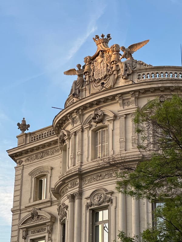 Tourist captures Madrid landmarks during evening city walk