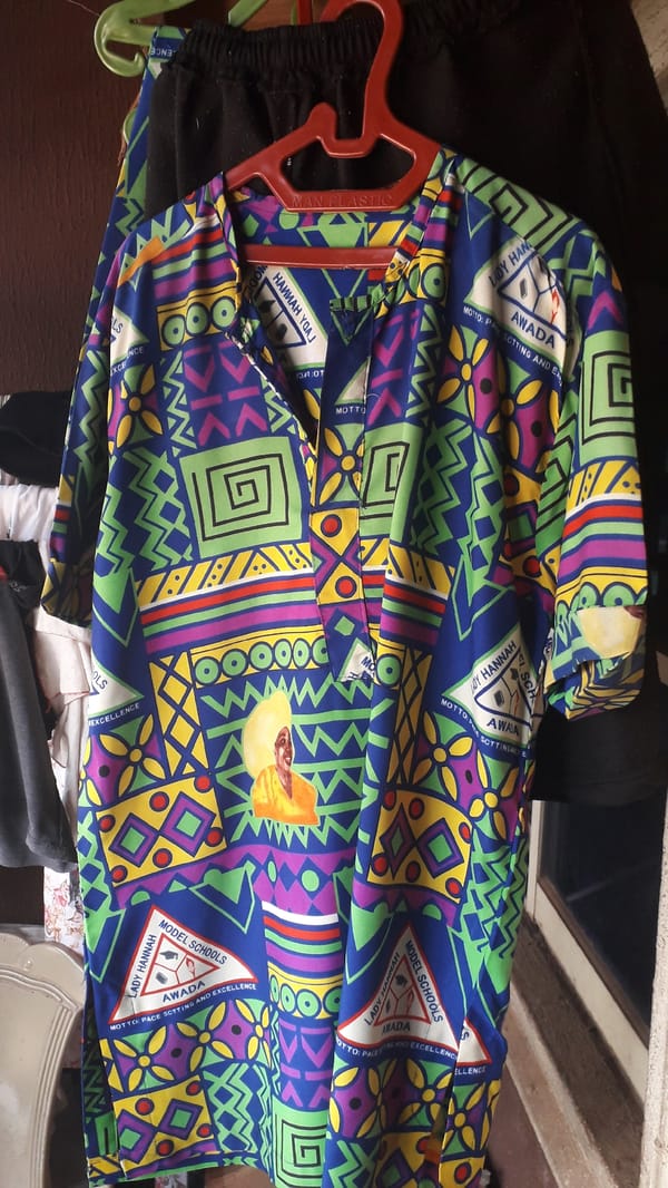 Geometric-patterned uniform garment spotted hanging on red hanger