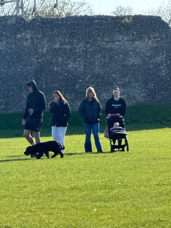 Family visits historic Berkhamsted Castle on sunny afternoon