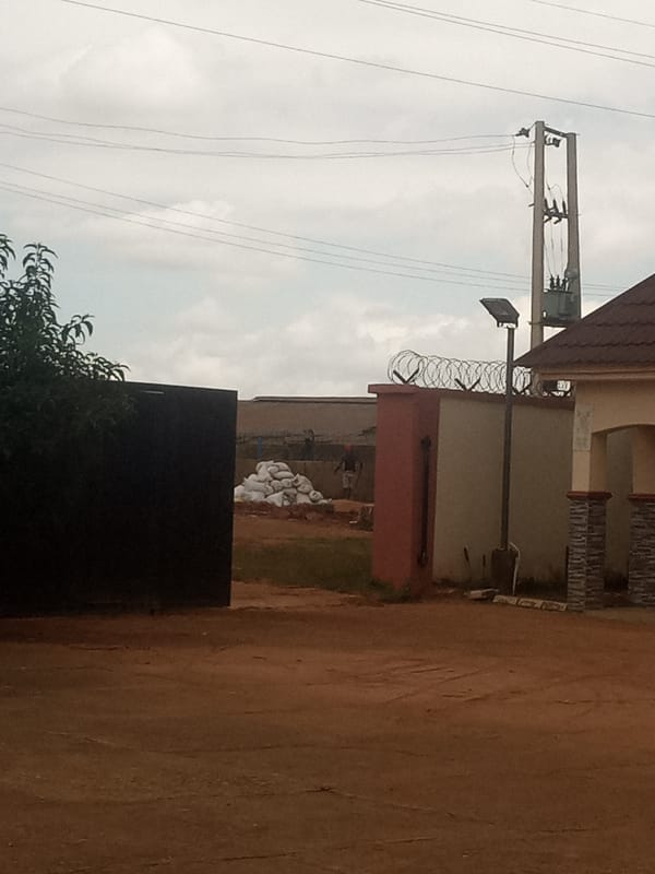 Afternoon street life and stormy skies in Jos, Nigeria