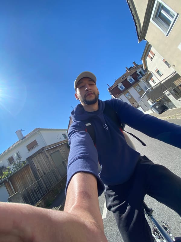 Cyclist spotted riding through Hoenheim streets in afternoon