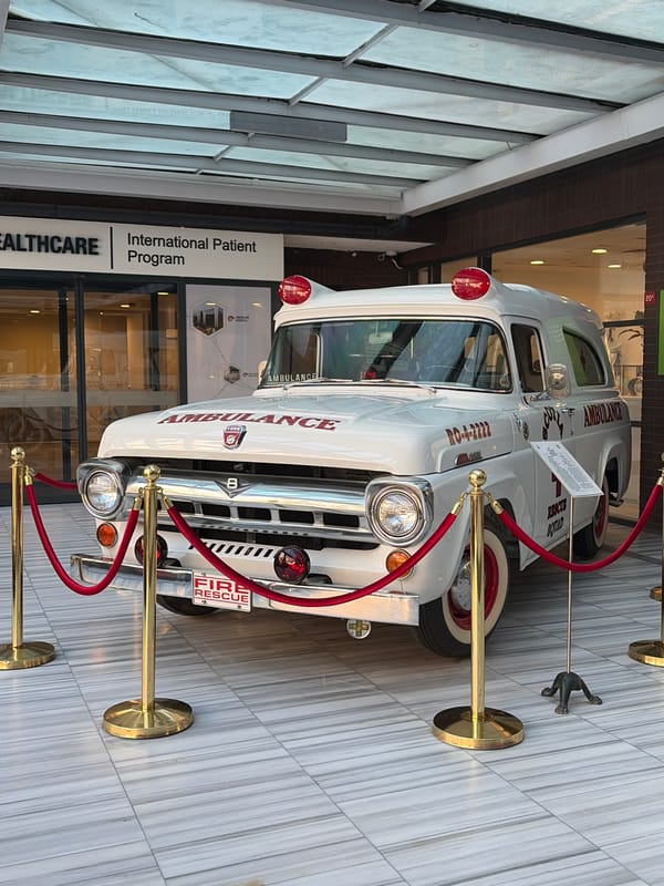 Vintage ambulance displayed in Turkish healthcare facility lobby