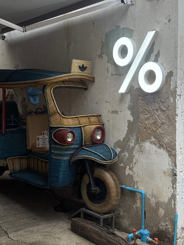 Street textures, tuk-tuks, and creative retail along Song Wat