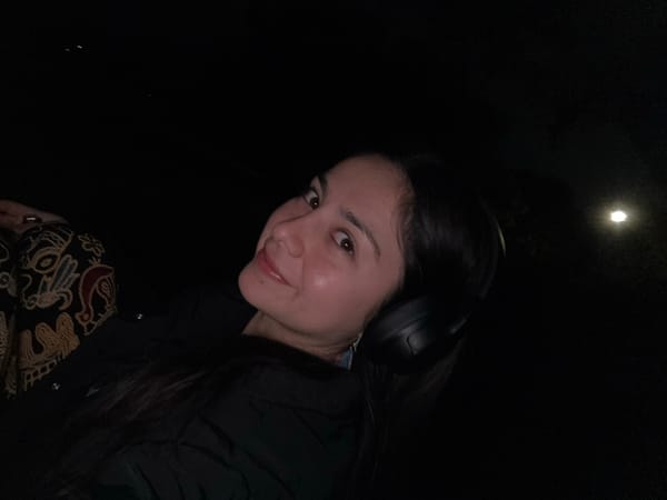 Woman in headphones photographed in Como, Australia