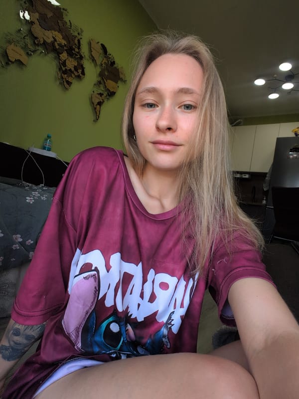 Casual indoor portrait featuring a Lilo & Stitch graphic tee