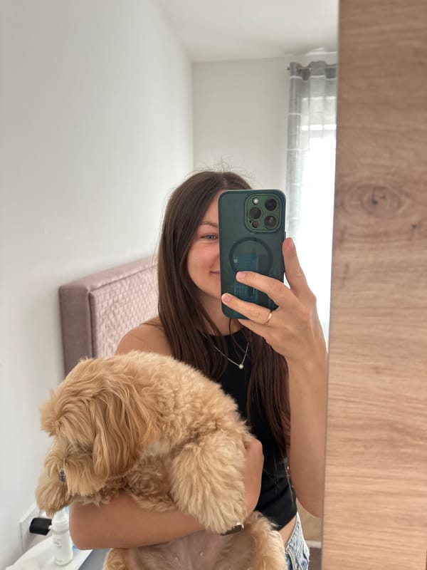 Woman takes selfie with dog in Montenegro village