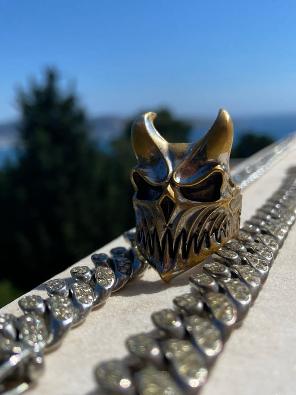 Man displays ornate jewelry collection during Montenegro selfie session