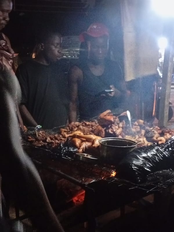 Evening street scenes and a roadside grill in Nkpor, Nigeria