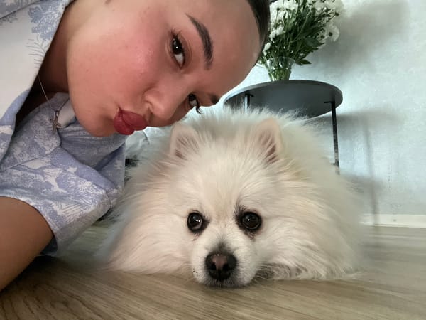 Woman Takes Selfie With White Dog in Лобаново