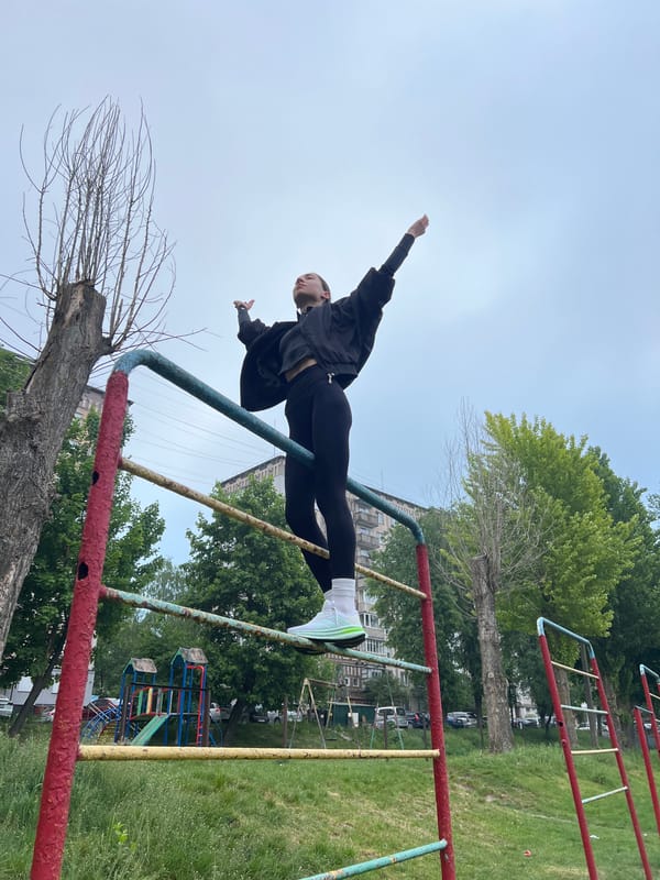 Early morning workout session at Ternopil park playground equipment