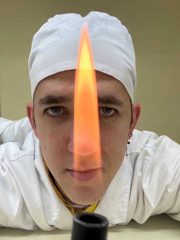 Person in white uniform holds lit torch in Saratov